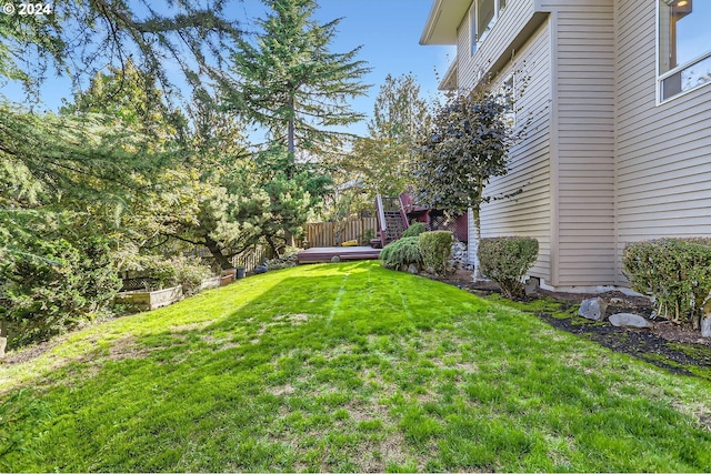 view of yard featuring a wooden deck