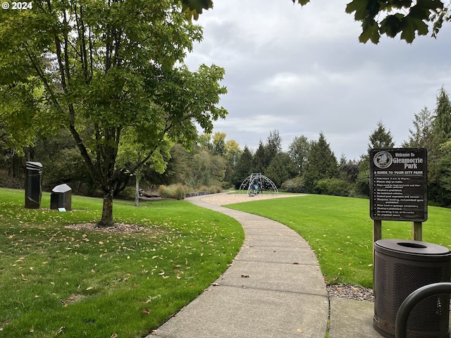 view of home's community with a yard