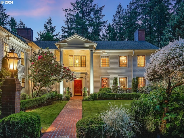 view of front of house with a yard