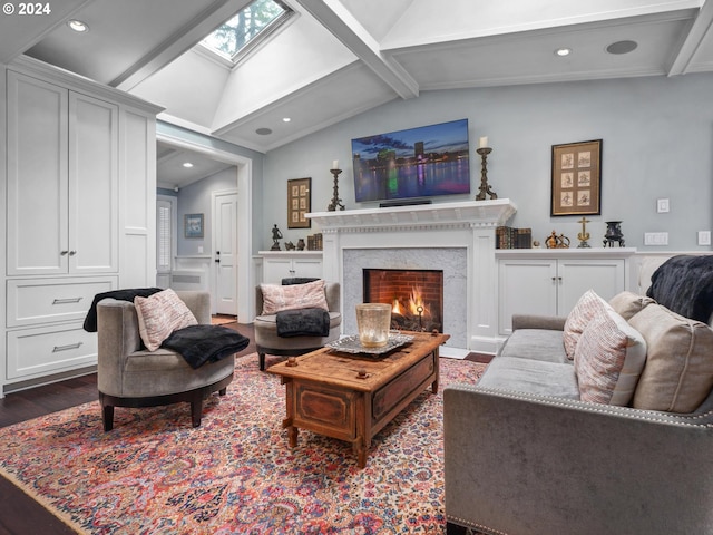 living room with dark wood-type flooring, a premium fireplace, and lofted ceiling with skylight