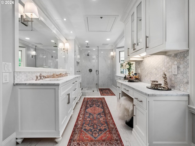 bathroom with vanity, plenty of natural light, and walk in shower