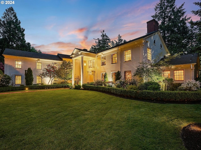 view of front of home with a lawn