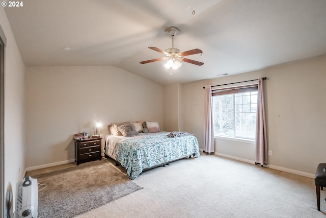 bedroom featuring ceiling fan, carpet floors, and lofted ceiling