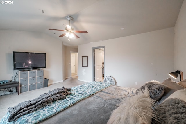 bedroom featuring ceiling fan, light colored carpet, and lofted ceiling