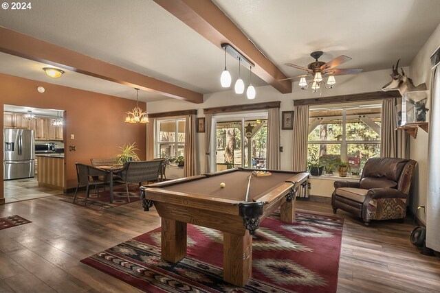 dining room with a notable chandelier, beamed ceiling, and dark wood-type flooring