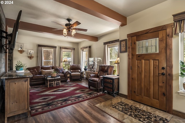 foyer with dark hardwood / wood-style floors and ceiling fan