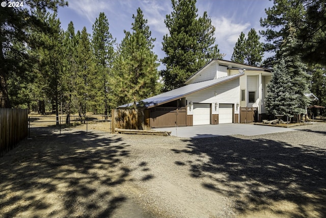 view of side of home with a garage