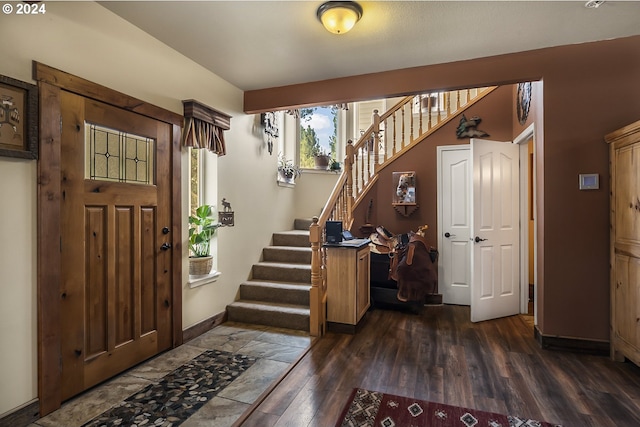 foyer with dark hardwood / wood-style flooring