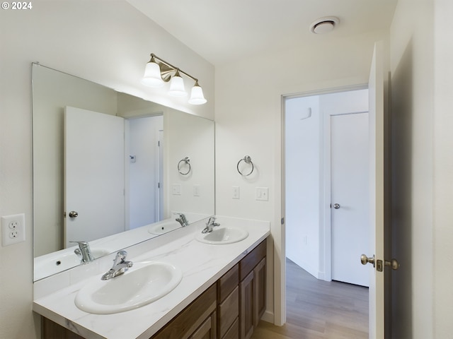 bathroom featuring vanity and wood-type flooring