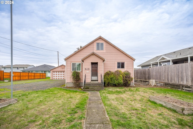 bungalow-style home with a front yard