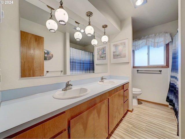 bathroom featuring toilet and vanity