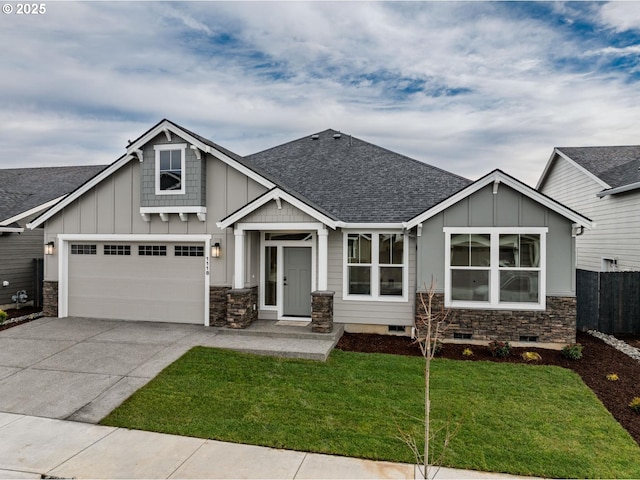 craftsman house with a garage and a front yard