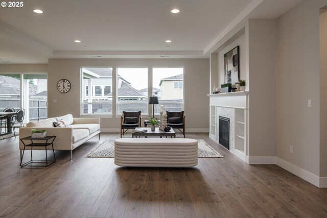 living room featuring light hardwood / wood-style floors, sink, and a chandelier