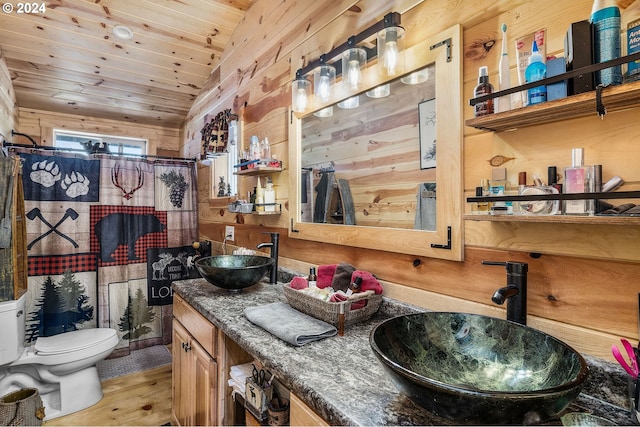 bathroom with wood ceiling, vanity, hardwood / wood-style flooring, toilet, and wood walls