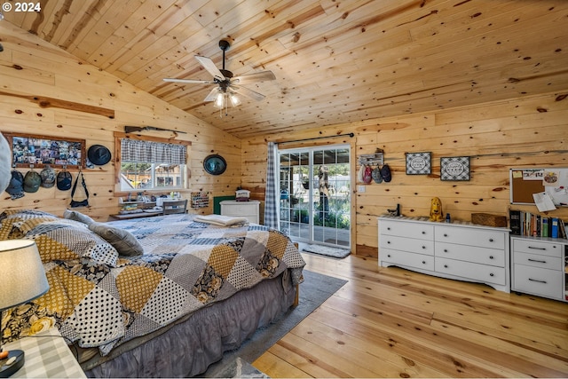 bedroom featuring ceiling fan, light hardwood / wood-style flooring, wooden ceiling, lofted ceiling, and wood walls