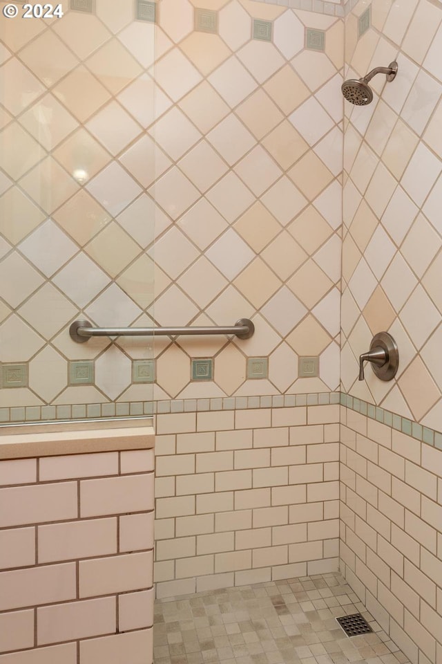 bathroom with a tile shower