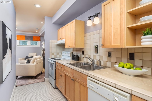 kitchen with tile countertops, light brown cabinetry, white appliances, and sink