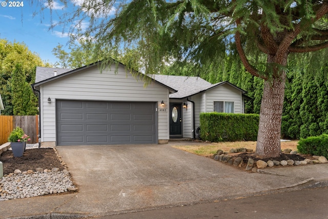 ranch-style home featuring a garage