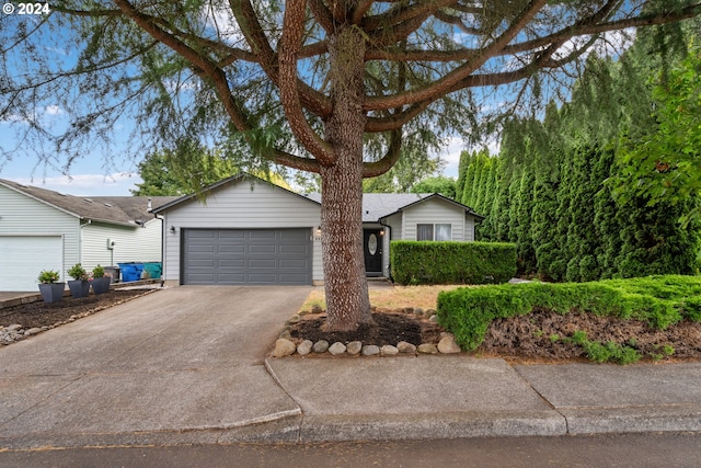 single story home featuring a garage