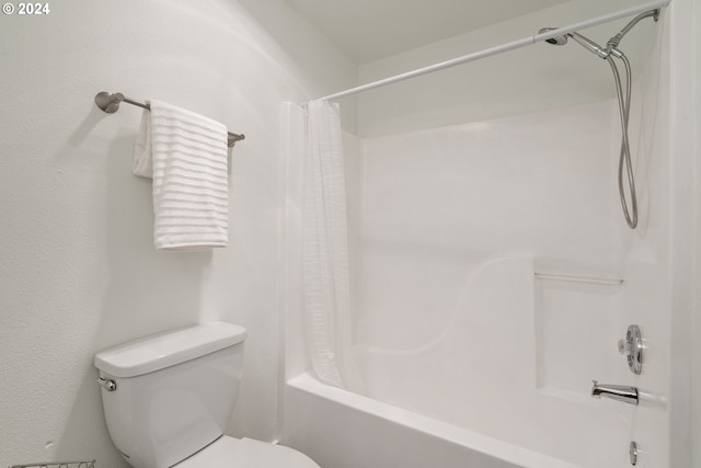 bathroom featuring toilet and shower / bathtub combination with curtain