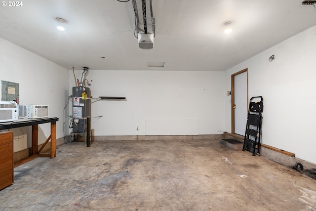 garage featuring a garage door opener and water heater