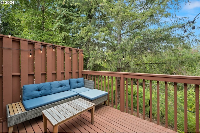 wooden terrace featuring outdoor lounge area