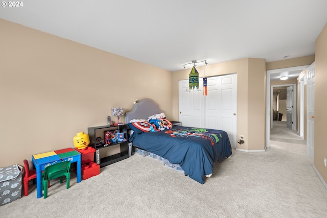 carpeted bedroom with a closet