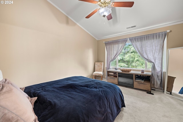 carpeted bedroom with lofted ceiling, crown molding, and ceiling fan