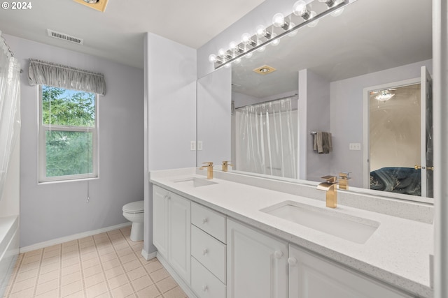 full bathroom featuring tile patterned flooring, shower / bath combo with shower curtain, toilet, and dual bowl vanity