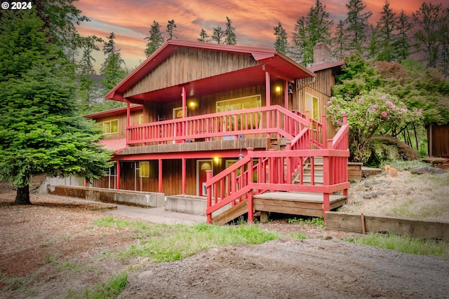 42681 Island Inn Dr, Lebanon, OR 97355 - chalet / cabin with a chimney, a wooden deck, and stairway