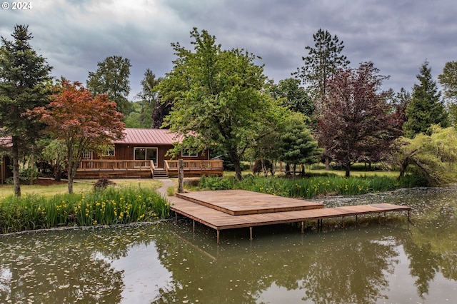 dock area with a water view