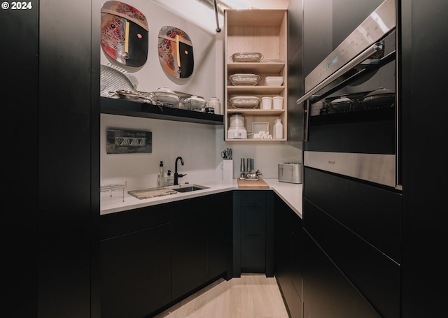 kitchen with sink and double wall oven