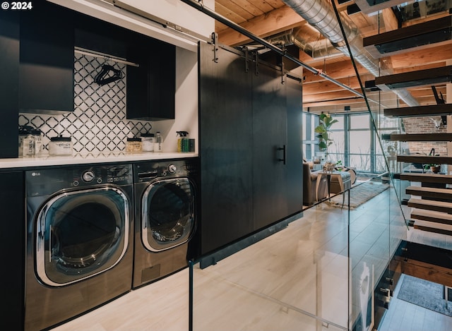 washroom featuring light wood-type flooring and washer and dryer