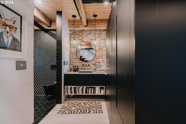 bathroom with wooden ceiling, beam ceiling, and vanity