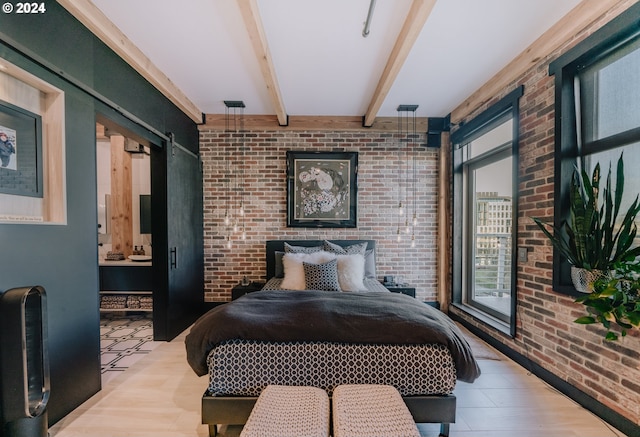 bedroom with brick wall, light hardwood / wood-style floors, and beam ceiling