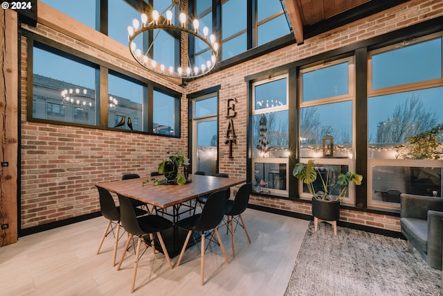 sunroom featuring an inviting chandelier