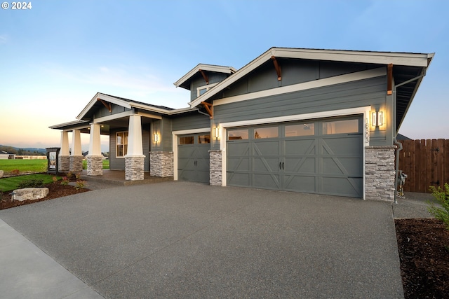 craftsman house with a garage