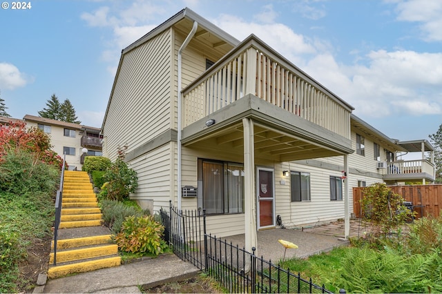 view of front of property with a balcony