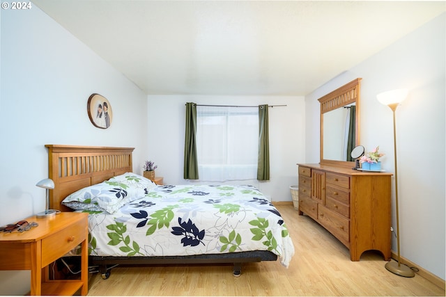 bedroom with light wood-type flooring