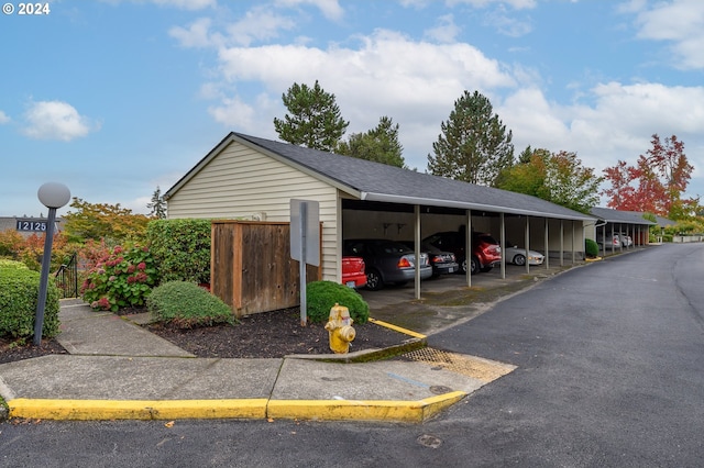 view of vehicle parking featuring a carport