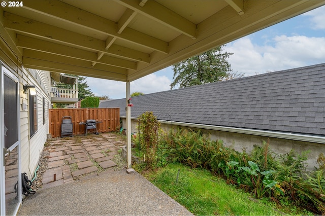 view of patio featuring fence
