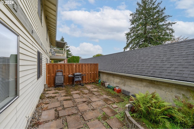 view of patio with fence and area for grilling