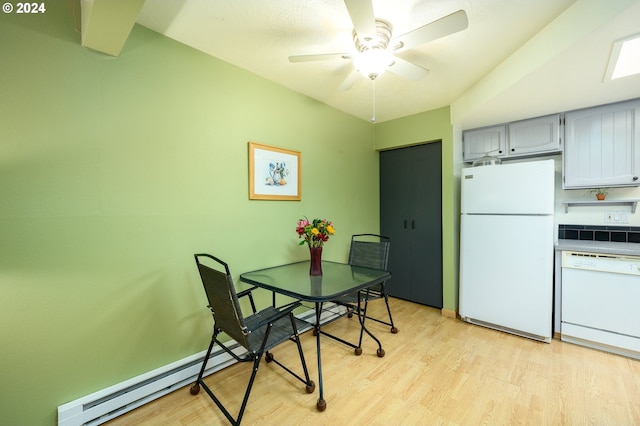 dining room featuring light hardwood / wood-style floors, a baseboard radiator, and ceiling fan