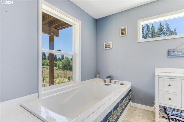 bathroom with a relaxing tiled tub