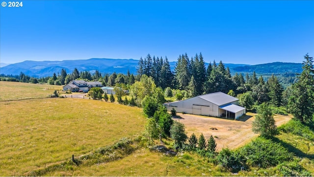 birds eye view of property with a mountain view