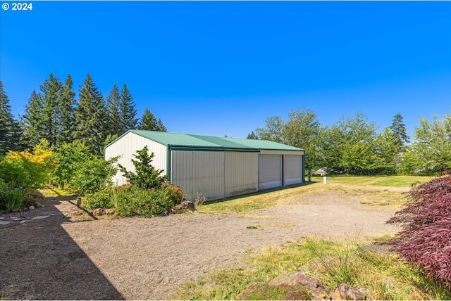 exterior space featuring an outbuilding and a garage