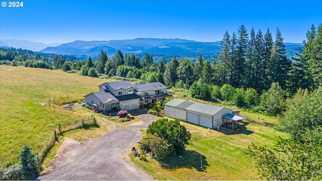 birds eye view of property featuring a mountain view