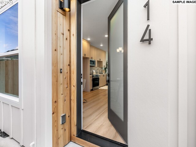 doorway to property featuring sink