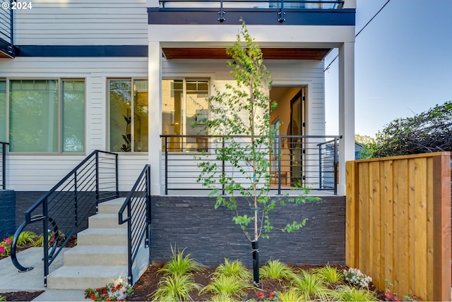 doorway to property featuring a balcony