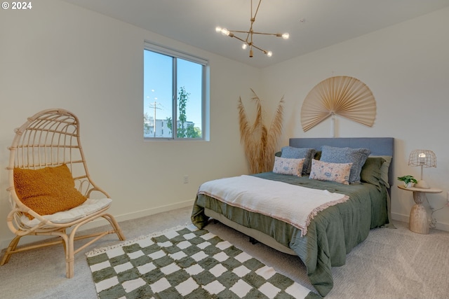 carpeted bedroom with an inviting chandelier